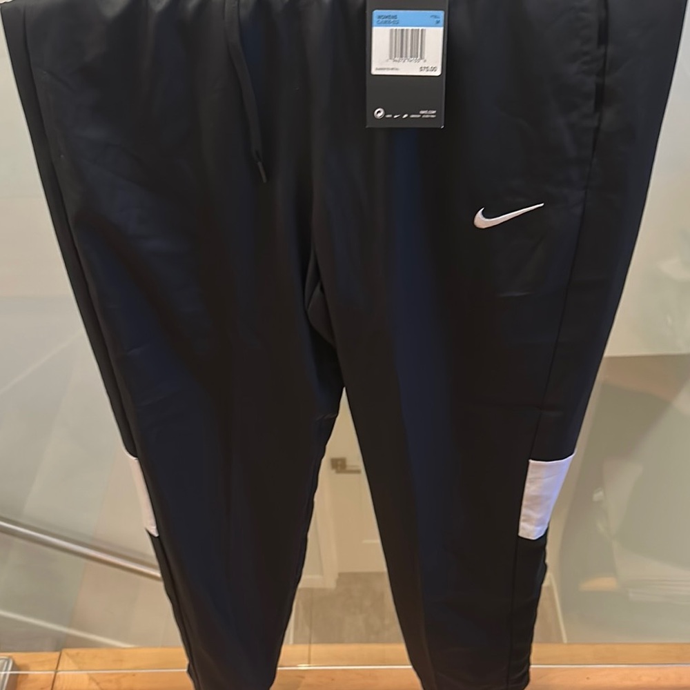 Nike Black and White Jogger Sweatpants with Tapered Design. 30.5” inseam.